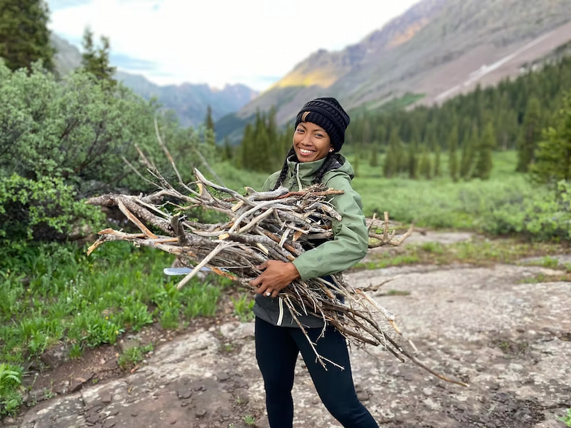 Collecting firewood for camp