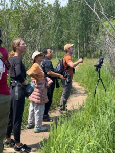 Birding Man guide with participants in a birding class