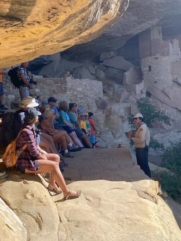 Guide discussing the history of Mesa Verde National Park for the Pueblo people