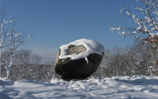 Wolf Rock in the snowy woods of Connecticut